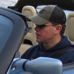 see full image of Matt Damon in a Tesla Roadster